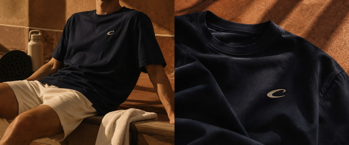 Player in a navy Calcuera T-shirt and white shorts courtside, with a close-up of the embroidered C logo